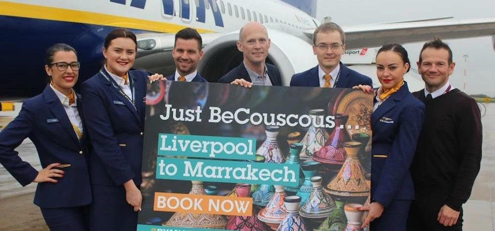 Liverpool airport's Mark Povall (centre) with Ryanair cabin crew