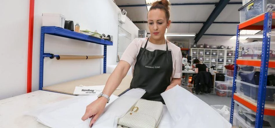 Alexandra Gibson restoring a designer handbag back to its former glory
