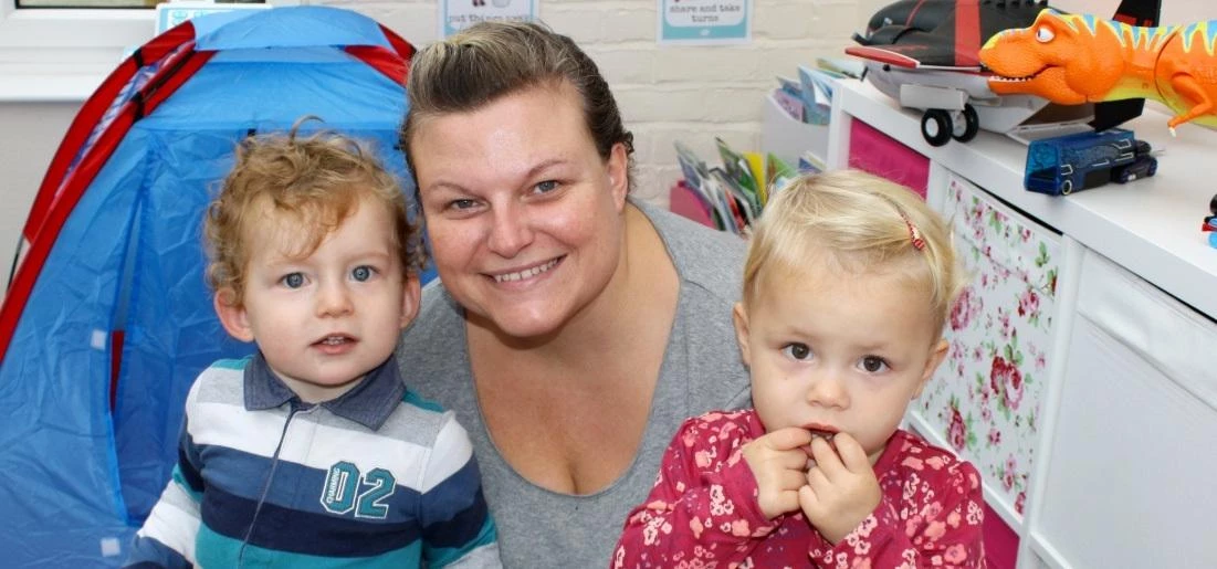 Angela Quinn with two of the adorabl children she cares for as part of her childminding service.