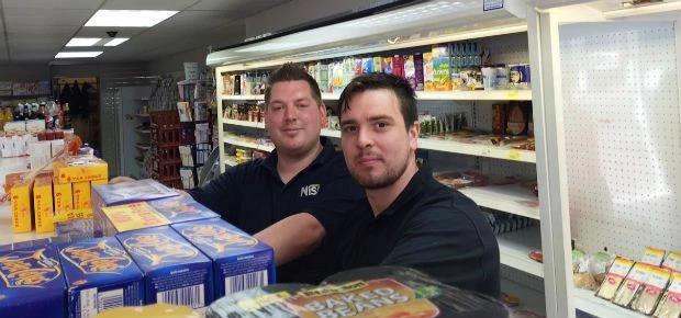 Newly appointed trainee merchandiser Sean Riley, right, working alongside his team leader Steven All