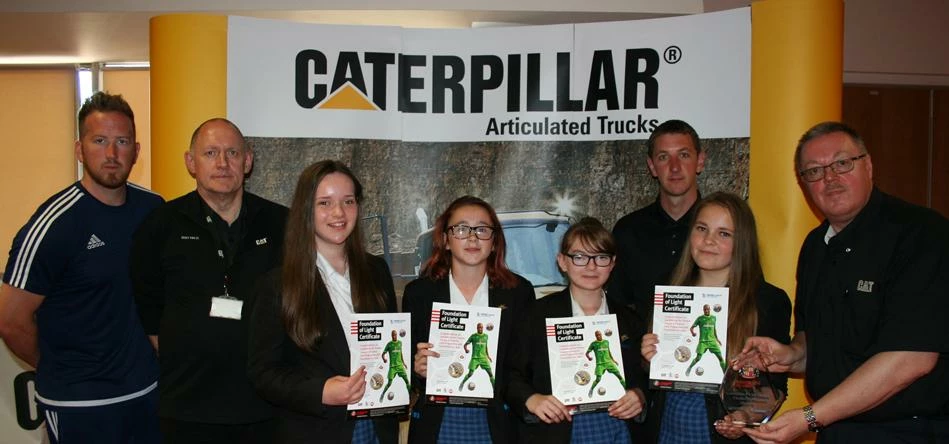 Winners with their awards backed by the judging panel