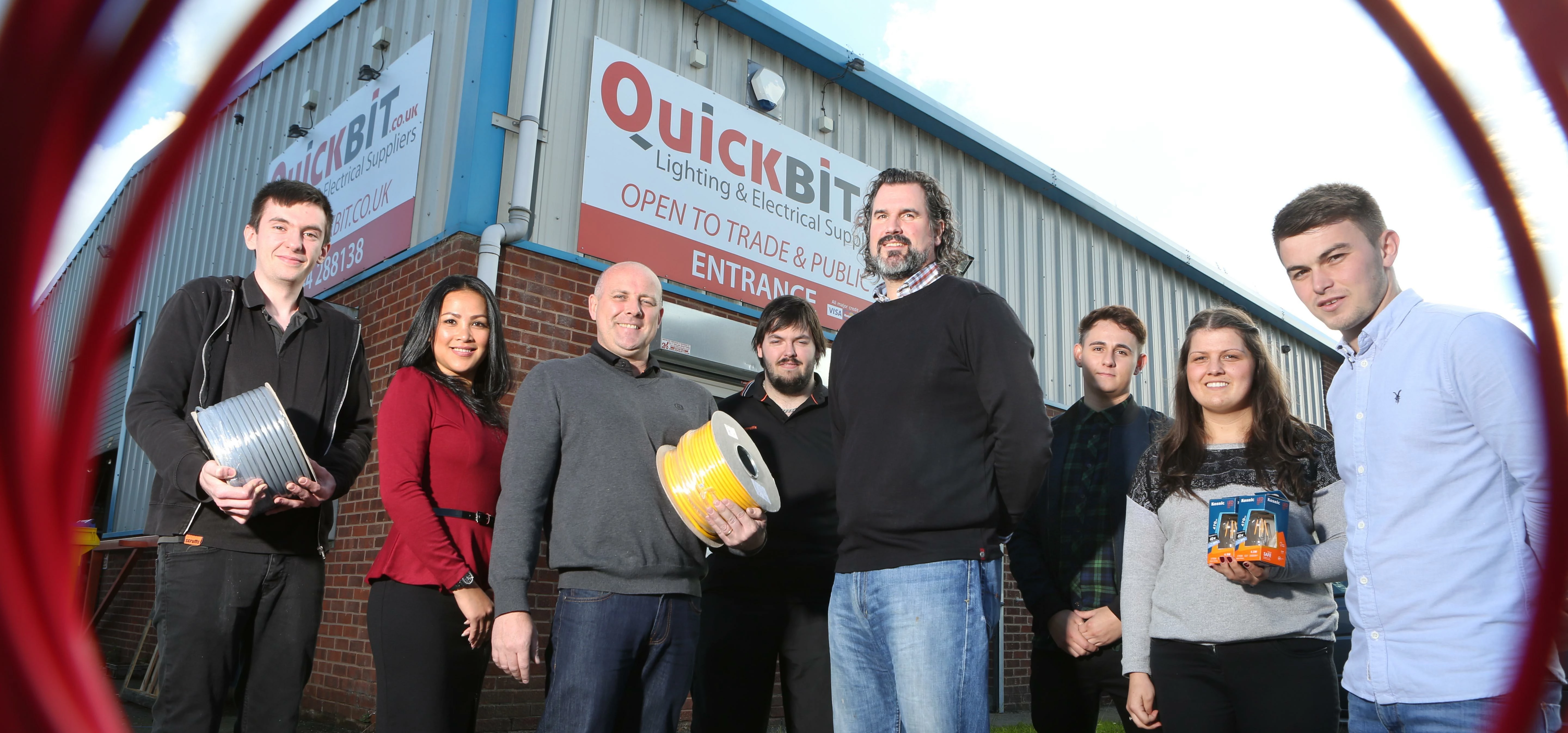 Stuart and Lee Guy with business partner David Baker (centre) and the Quickbit team at the Deeside I