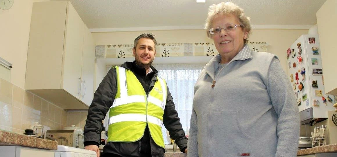 Salix Homes quantity surveyor John Darroch with resident Brenda Holland in her new kitchen