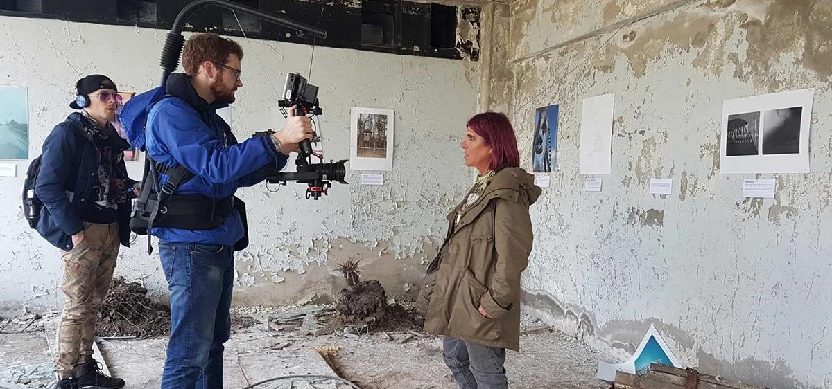 Claire Baker filming the Chernobyling Festival commercial at the Palace of Culture with the 'guerill