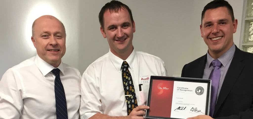 John Bull, centre, receives his Audi Spirit award from David Moran (right) Area Sales Manager at Aud