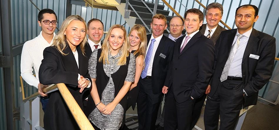 Juliet de Baubigny (on the left front row) with students and senior academics at Newcastle Business