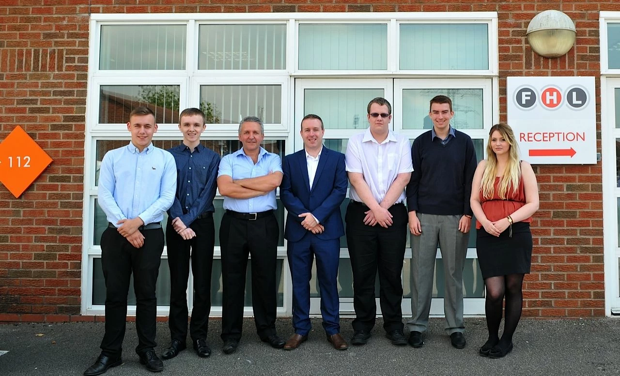 Andrew Peddie (third left) and Darren Birt (fourth left) with FHL apprentices