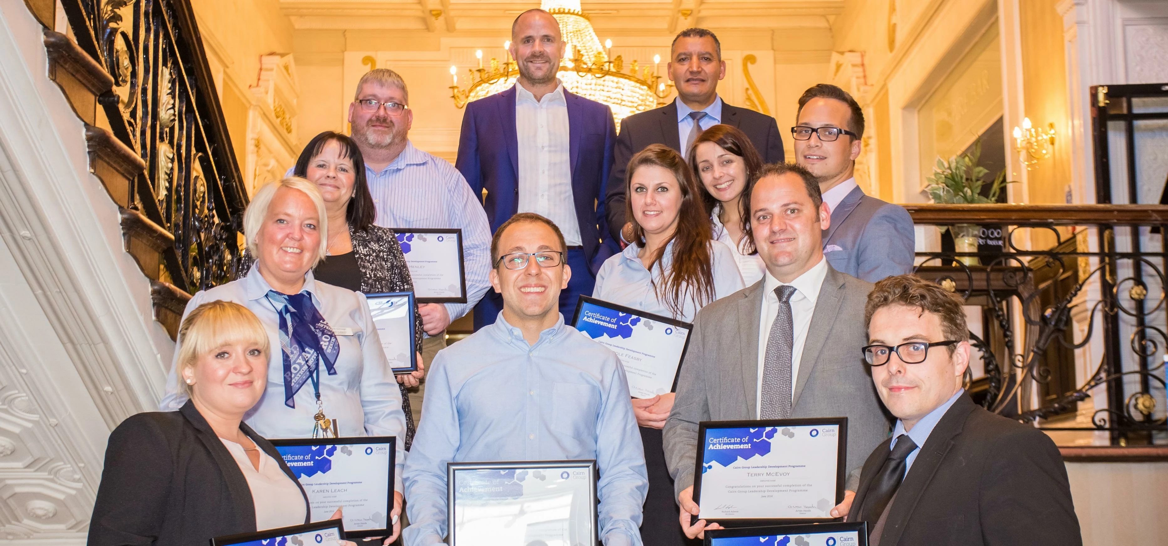 Cairn Group HR director Richard Adams and employees with their LDP certificates