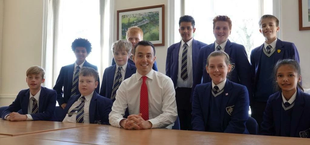 Leeds IT company boss and former Fulneck School pupil, Mark Fletcher, with current pupils who all st