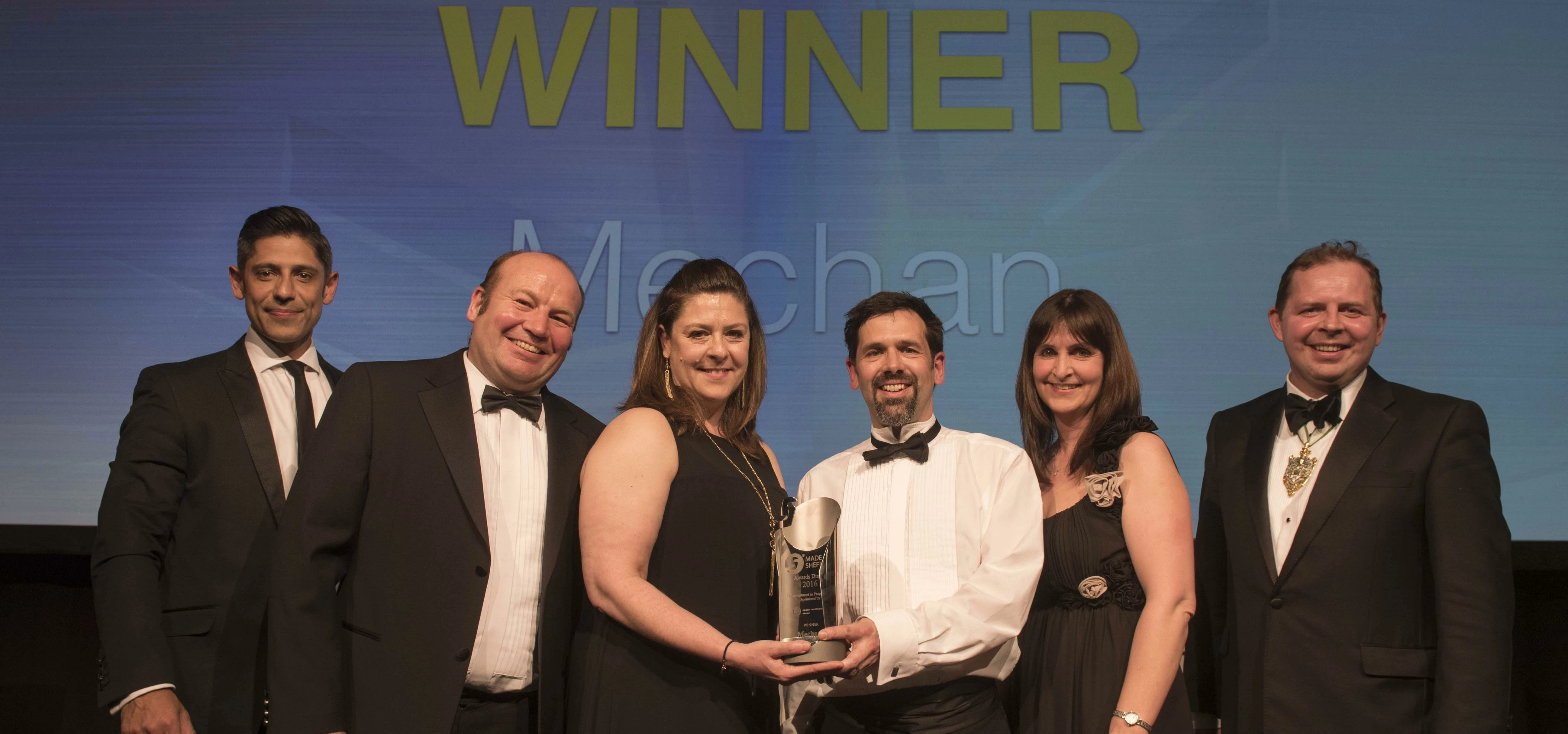 Mechan’s team collects the firm’s Made in Sheffield Award. Left to right: Lee Bhandal from sponsor, 
