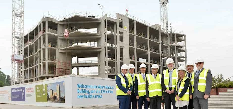 Major donor to the University, Dr Assem Allam, carried out the topping out ceremony.