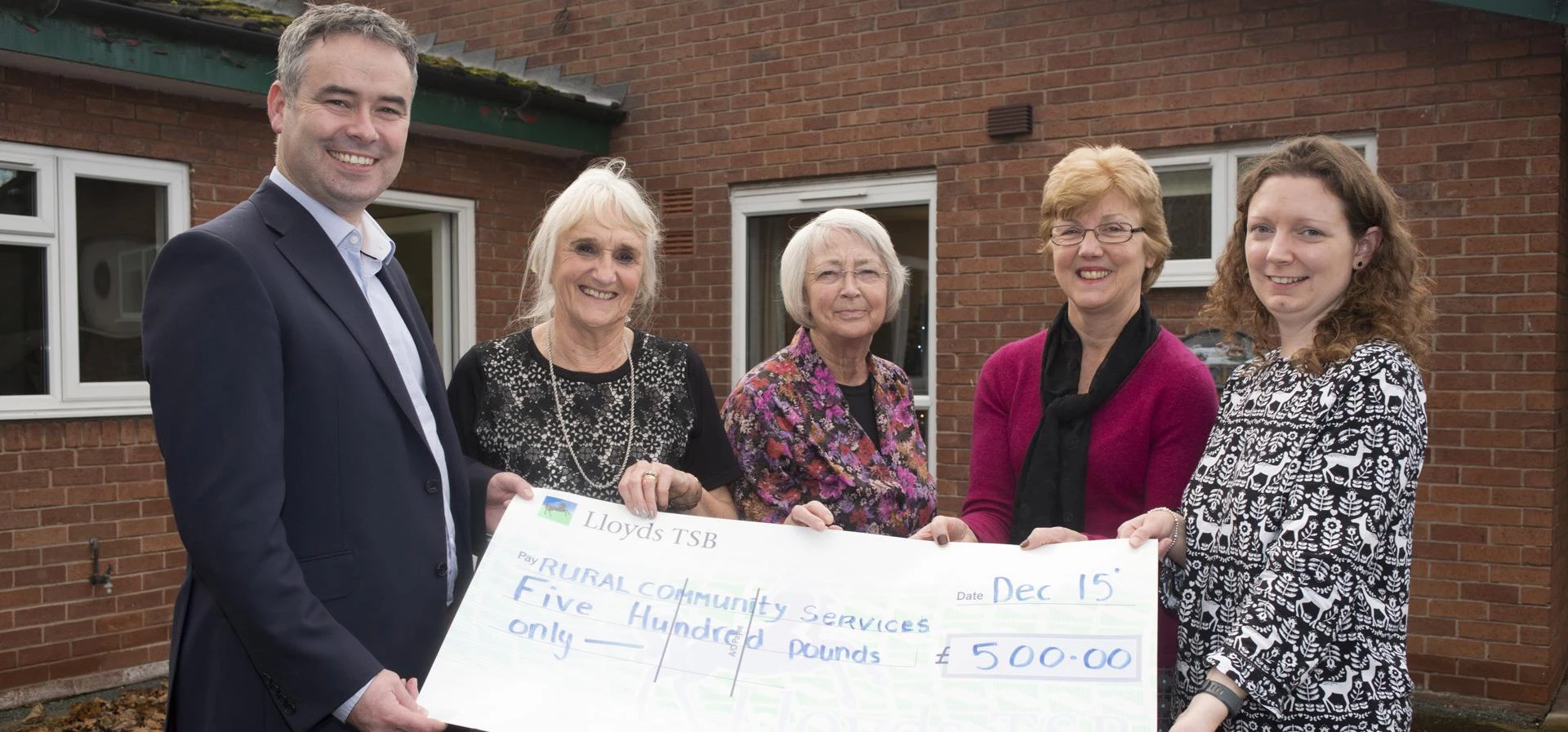 David McKendrick, Partner at Equilibrium Asset Management, presenting the cheque to club organiser Z