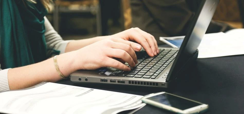 https://images.pexels.com/photos/7112/woman-typing-writing-windows.jpg?w=1260&h=750&auto=compress&cs