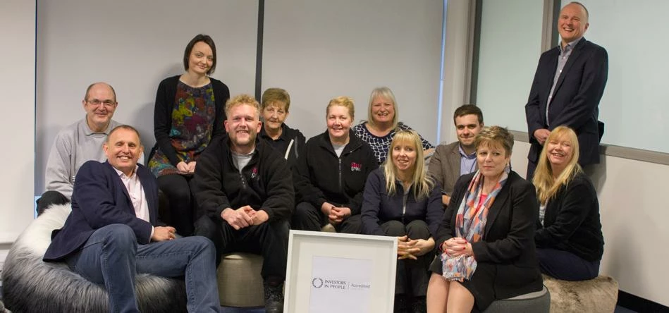 Bazaar Group managing director Mark Dolder (front left) with members of the team from every departme