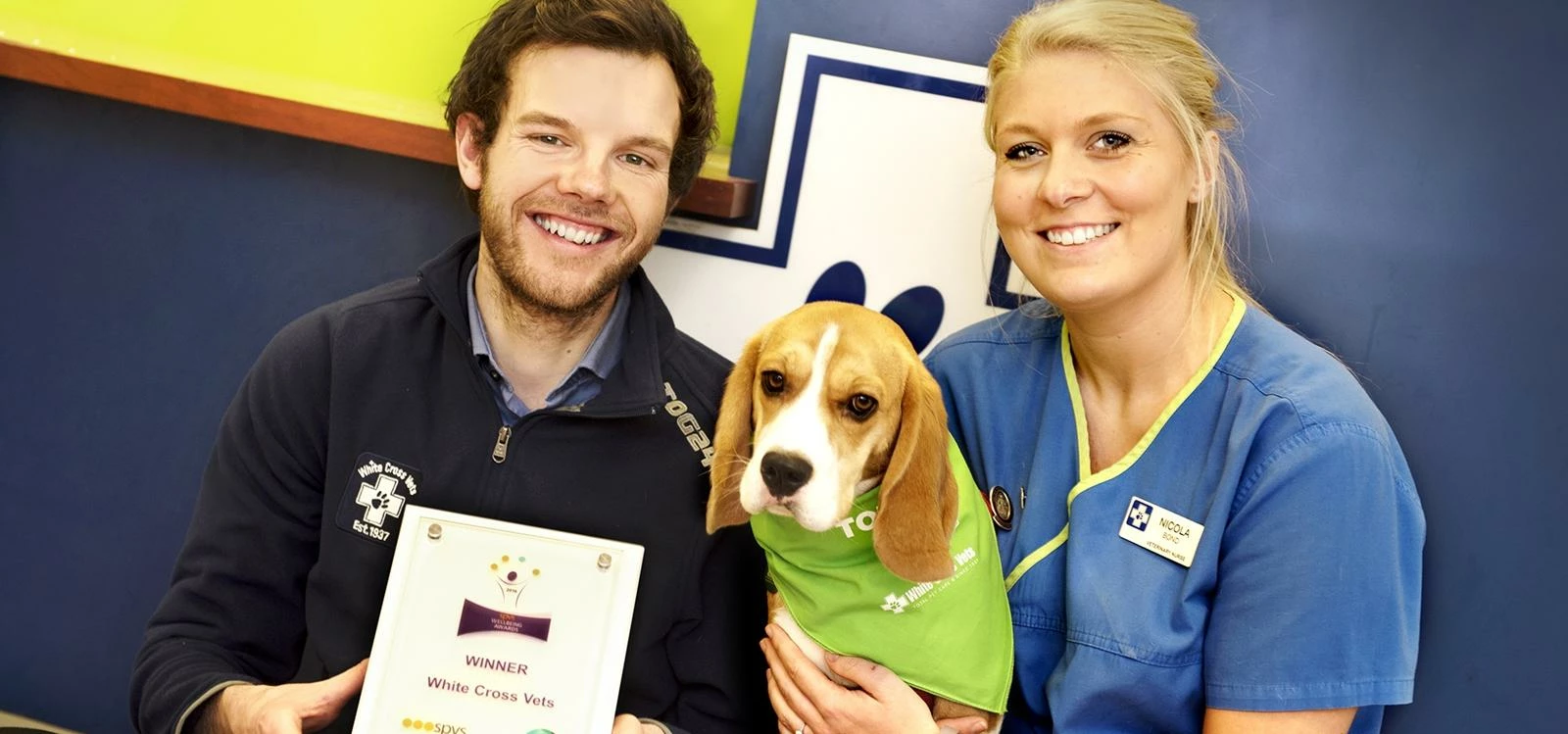 Ed Newbould, head of team engagement and development at White Cross Vets with veterinary nurse Nicol