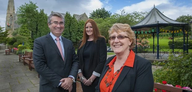 Newtons Solicitors new Ilkley office in the background are joint founder and managing director, Chri