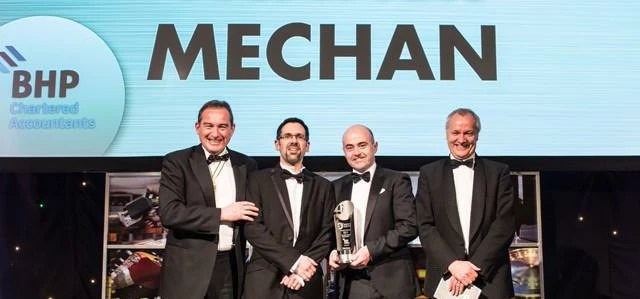 Mechan’s Martin Berry and Richard Carr (centre) accept the Made in Sheffield SME award from Master C
