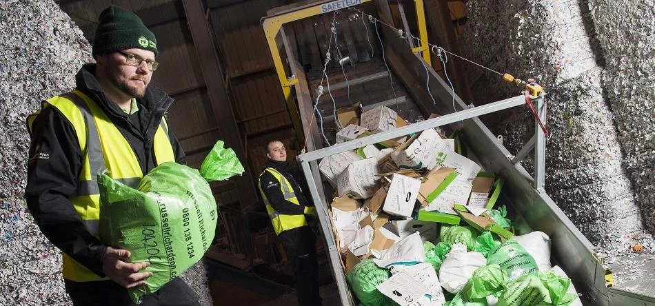 A Russell Richardson operative sends confidential data waste into the shredder 