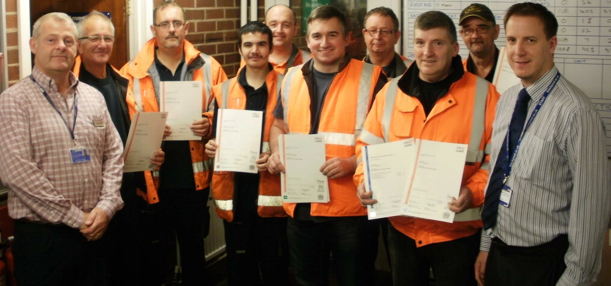 Northern Rail staff at Blackpool with certificates for completing their English, Maths and IT course