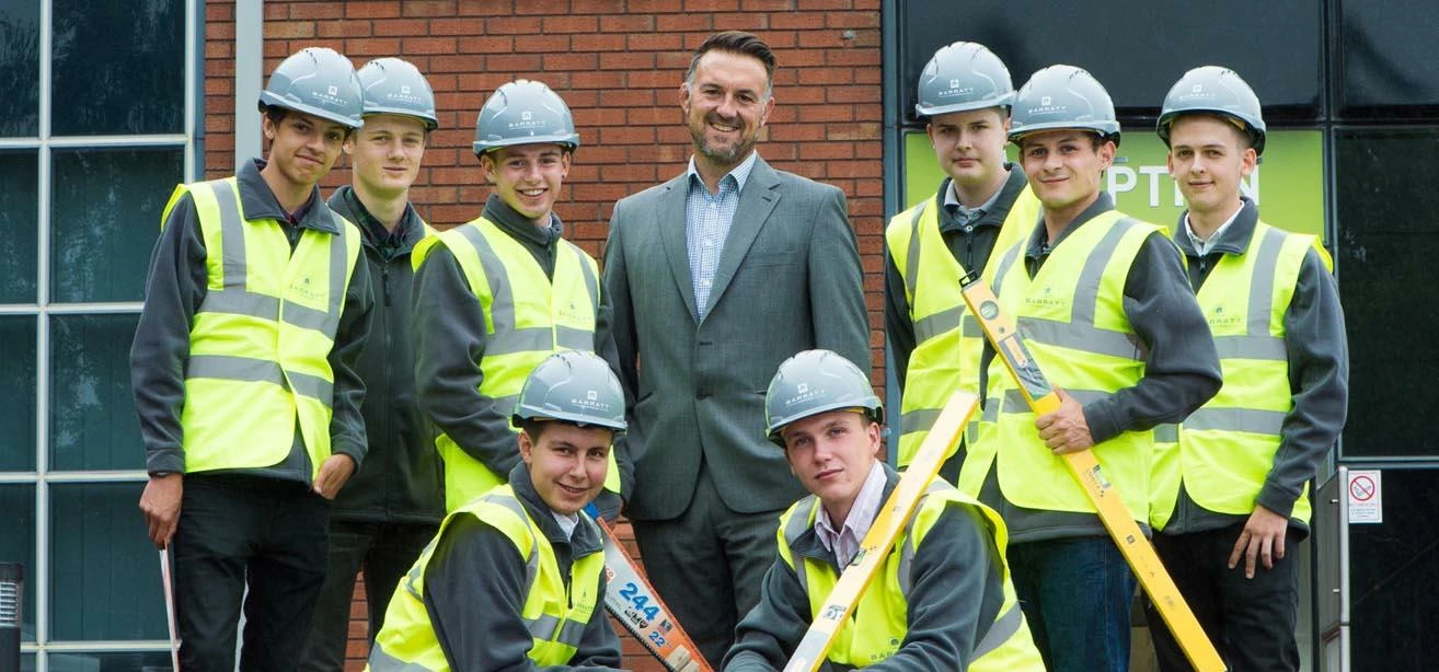 Barratt Homes construction manager Wayne Cole with the new intake of apprentices