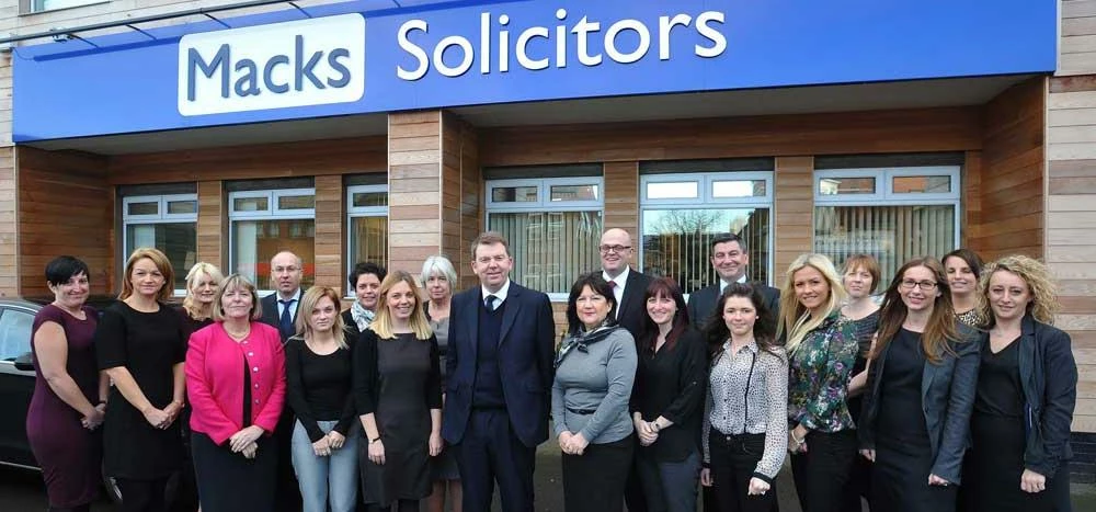 Senior Wills and Probate solicitor Lynda Monks, fourth from right, with Macks' colleagues