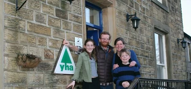 Saul Ward, his wife Floss and their two children outside the Kettlewell youth hostel