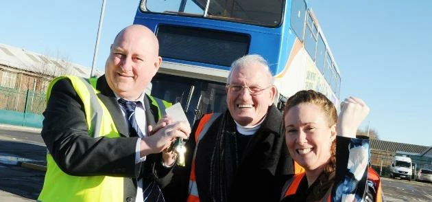 Gary Chisholm, Engineering Director for Stagecoach North East hands over the double decker bus to Fa