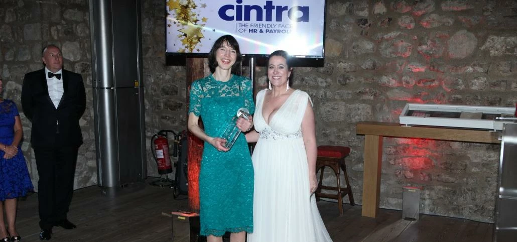 Jess McEvoy, Cintra HR & Payroll Services receiving the award from Melanie Pizzey, Global Payroll As