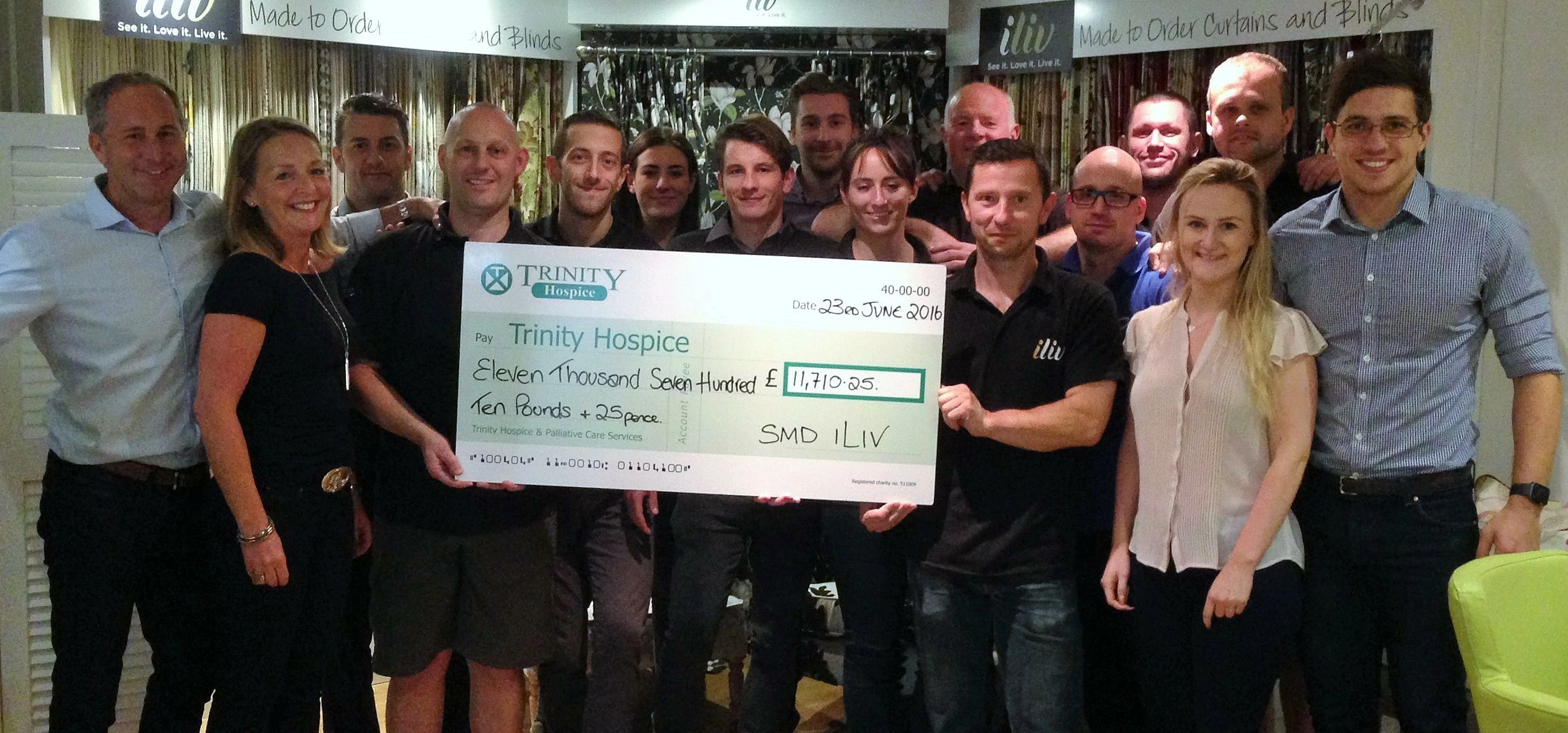 The SMD Group team presented the cheque to Trinity Hospice
