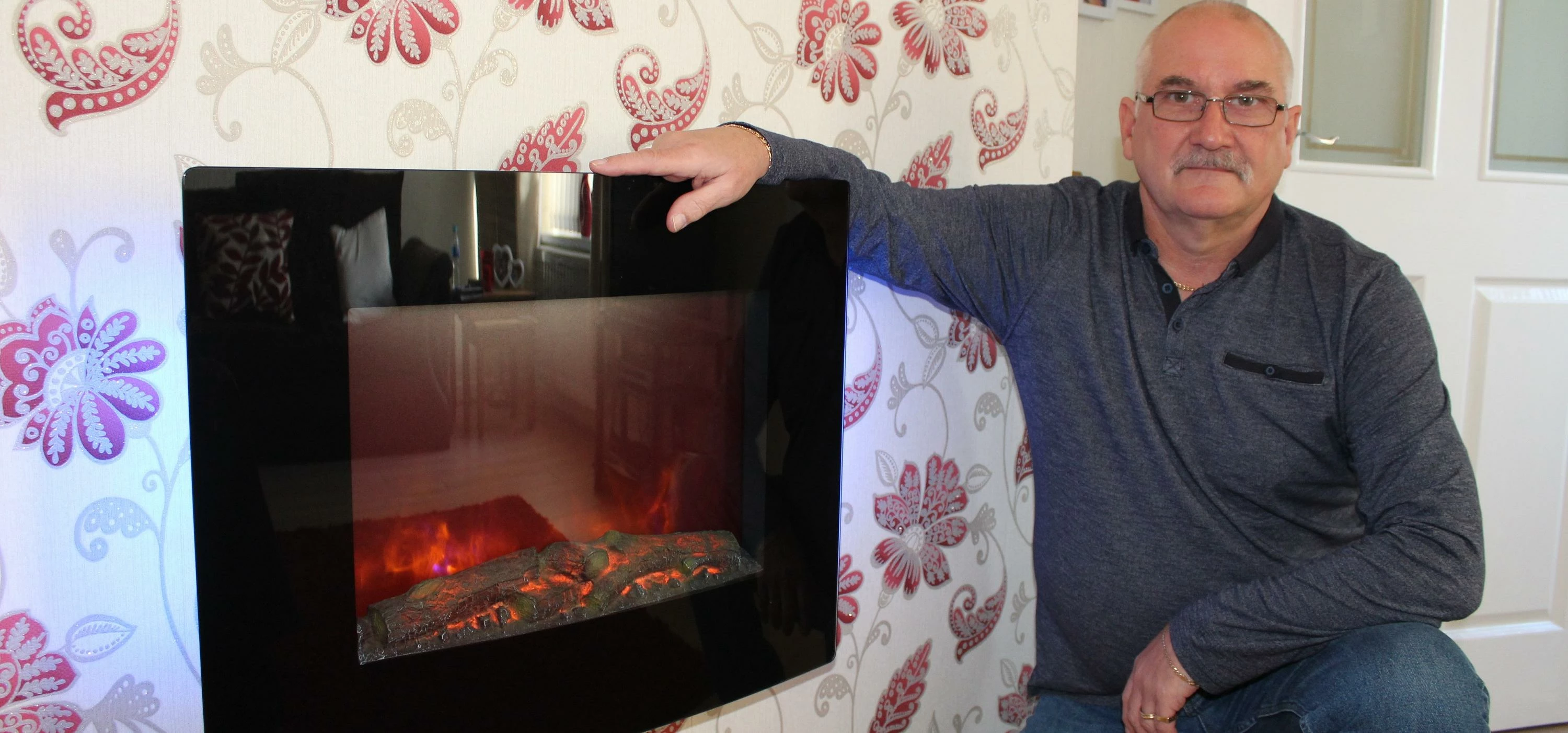  Billy Black with the new fire that has been installed in his home.