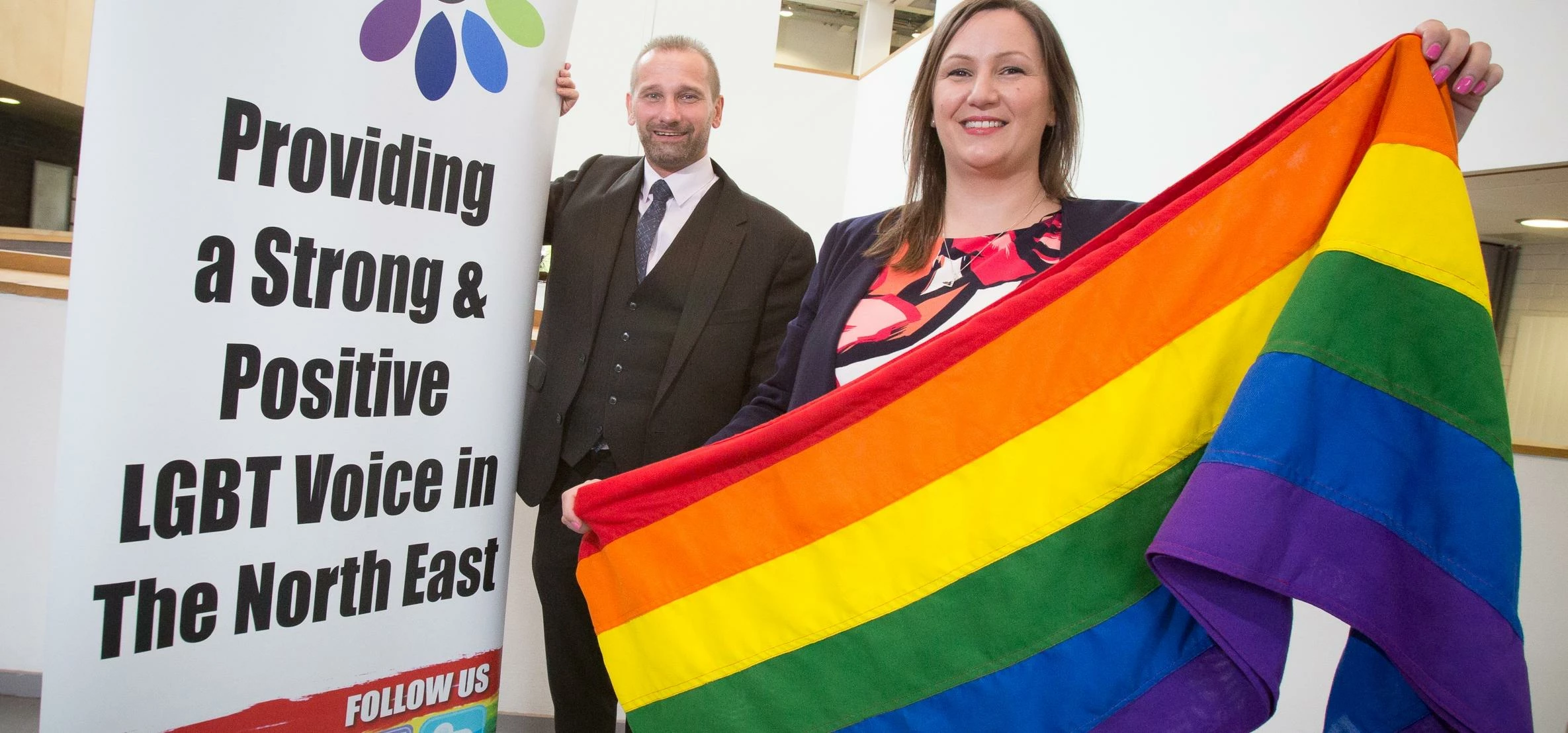 Mark Nichols, Chair of Northern Pride flies the rainbow flag with Anna Wadcock, General Manager for 