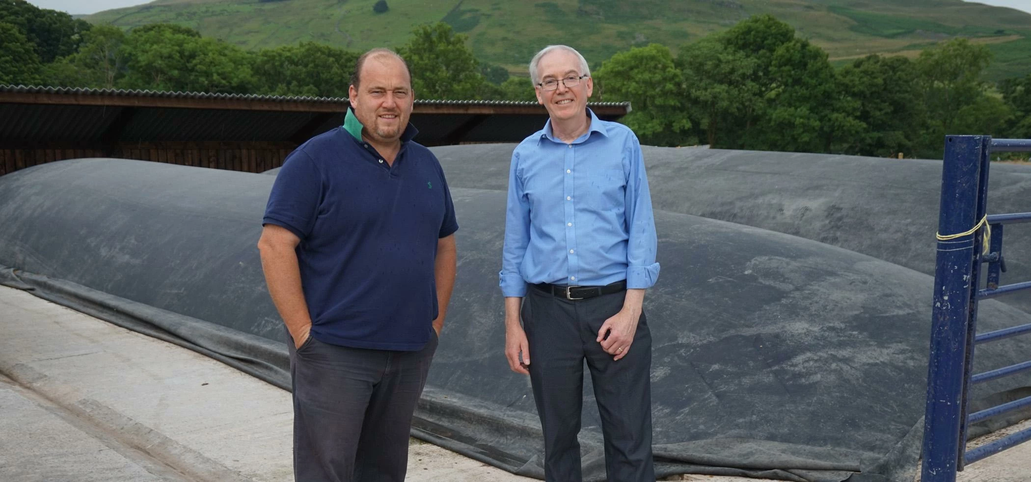 Brian Capstick (left) and Shaun Atherton in front of the dry anaerobic digestion system