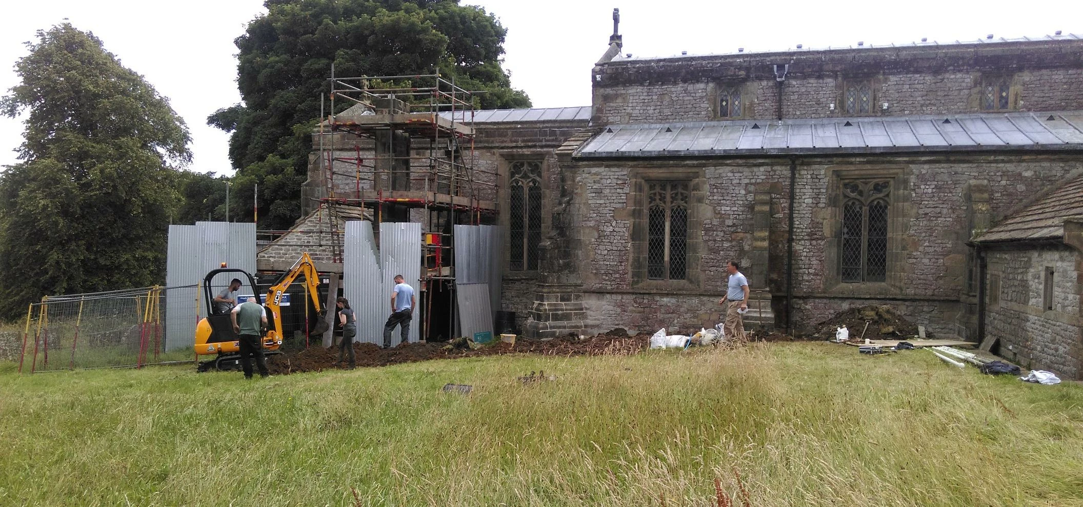 Martin-Brooks' heritage team prepares drainage channels at the grade I listed church in Taddington, 