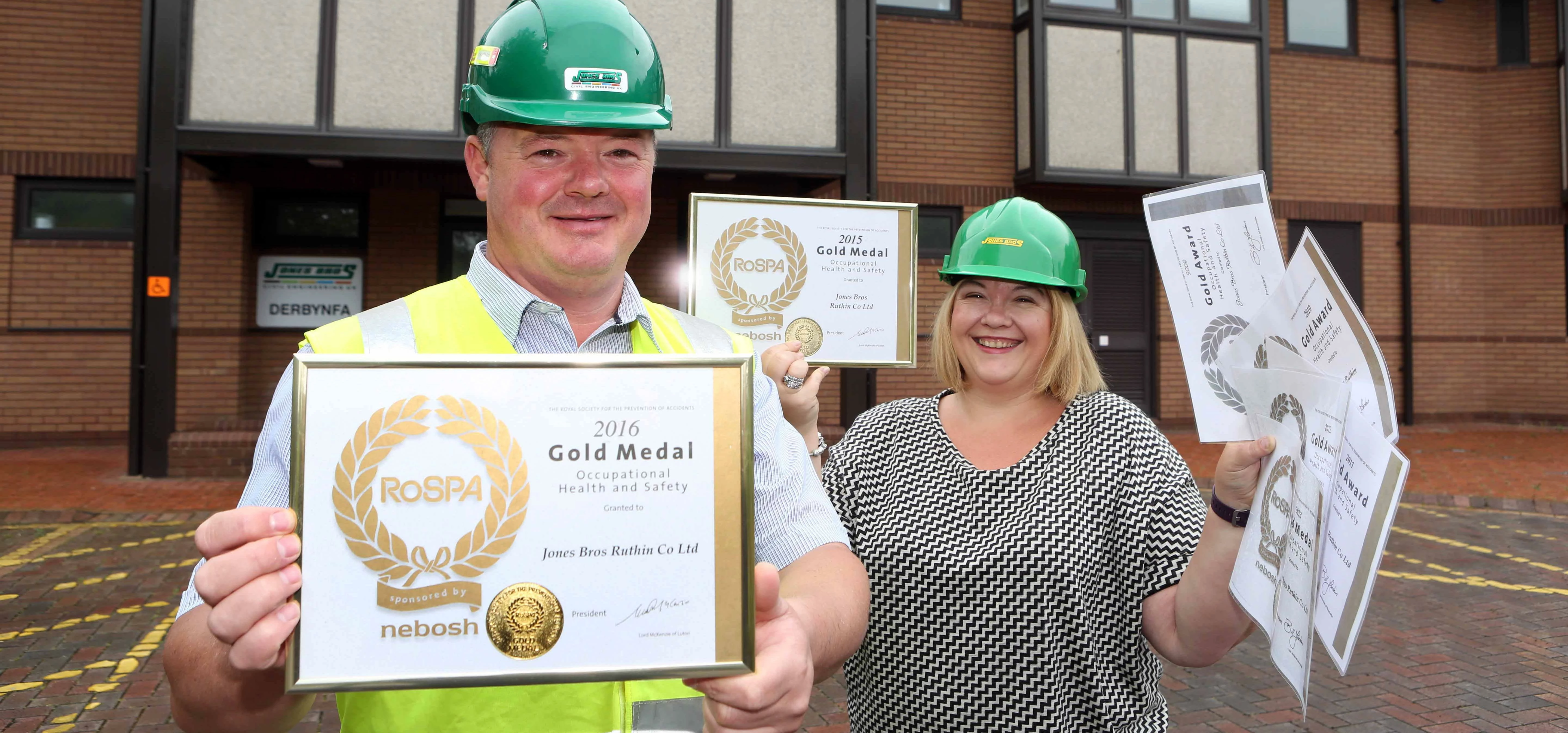 Health and safety manager Mike Mowbray needs a helping hand from colleague Ffion Roberts after winni