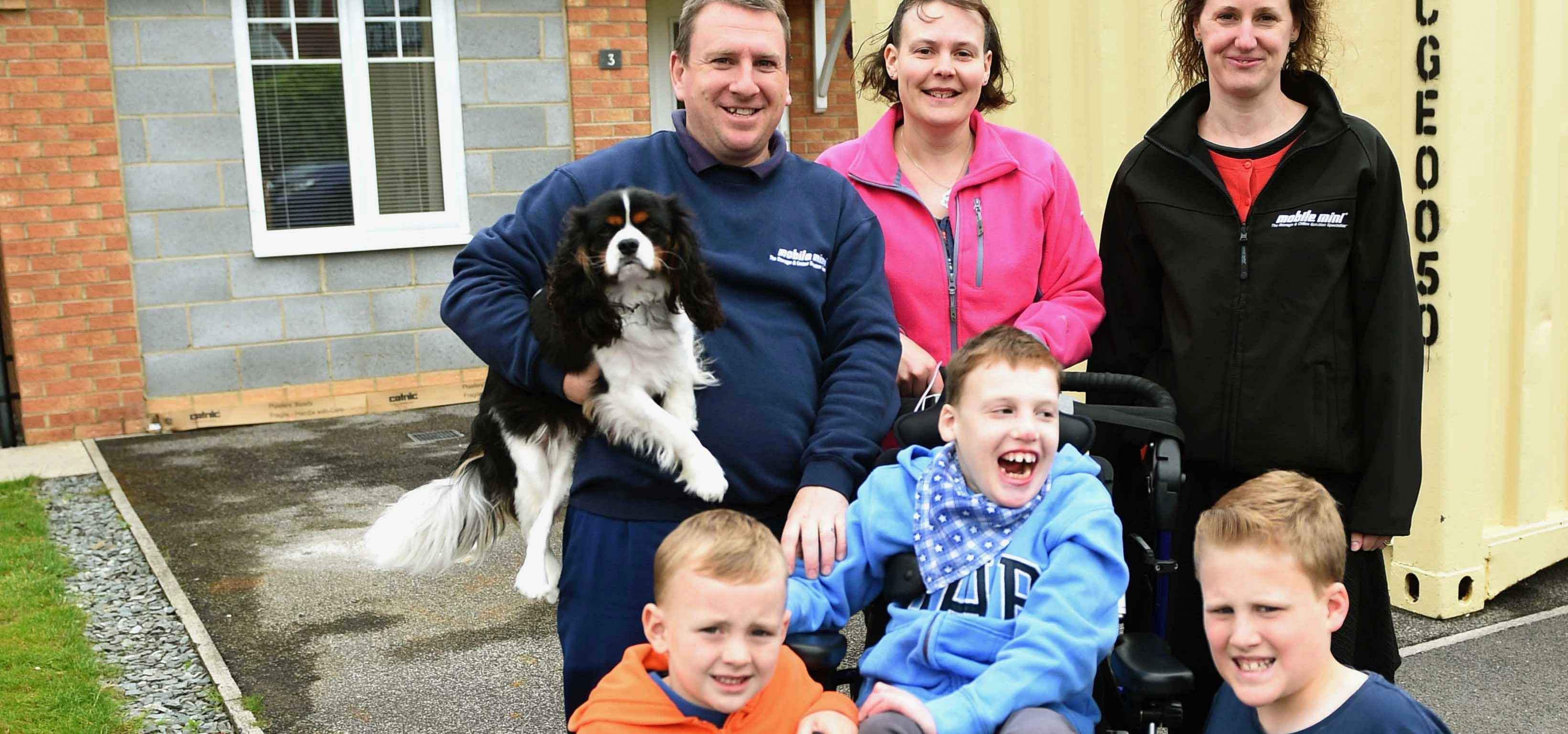 Keaton Oakes, centre, with his brothers Oliver and George (front) his dad Darren, his mum Romana and