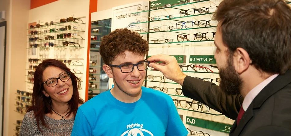CHECT ambassador Theo Sergiou tries on frames with mum Andria and Vision Express Wood Green store ma