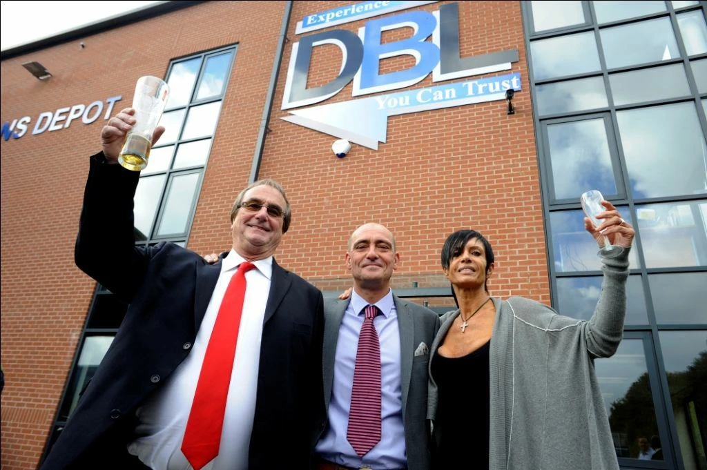 L-R: Bert, David and Sarah Clarkson toast the opening of the DBL Logistics depot