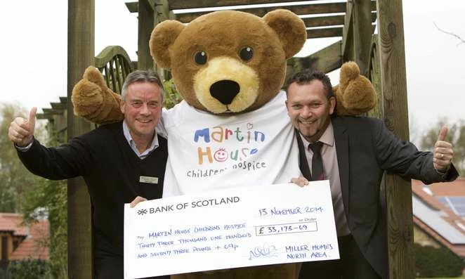 John Haigh, Corporate Fundraiser for Martin House with Neil Reaney, Customer Services Director for M