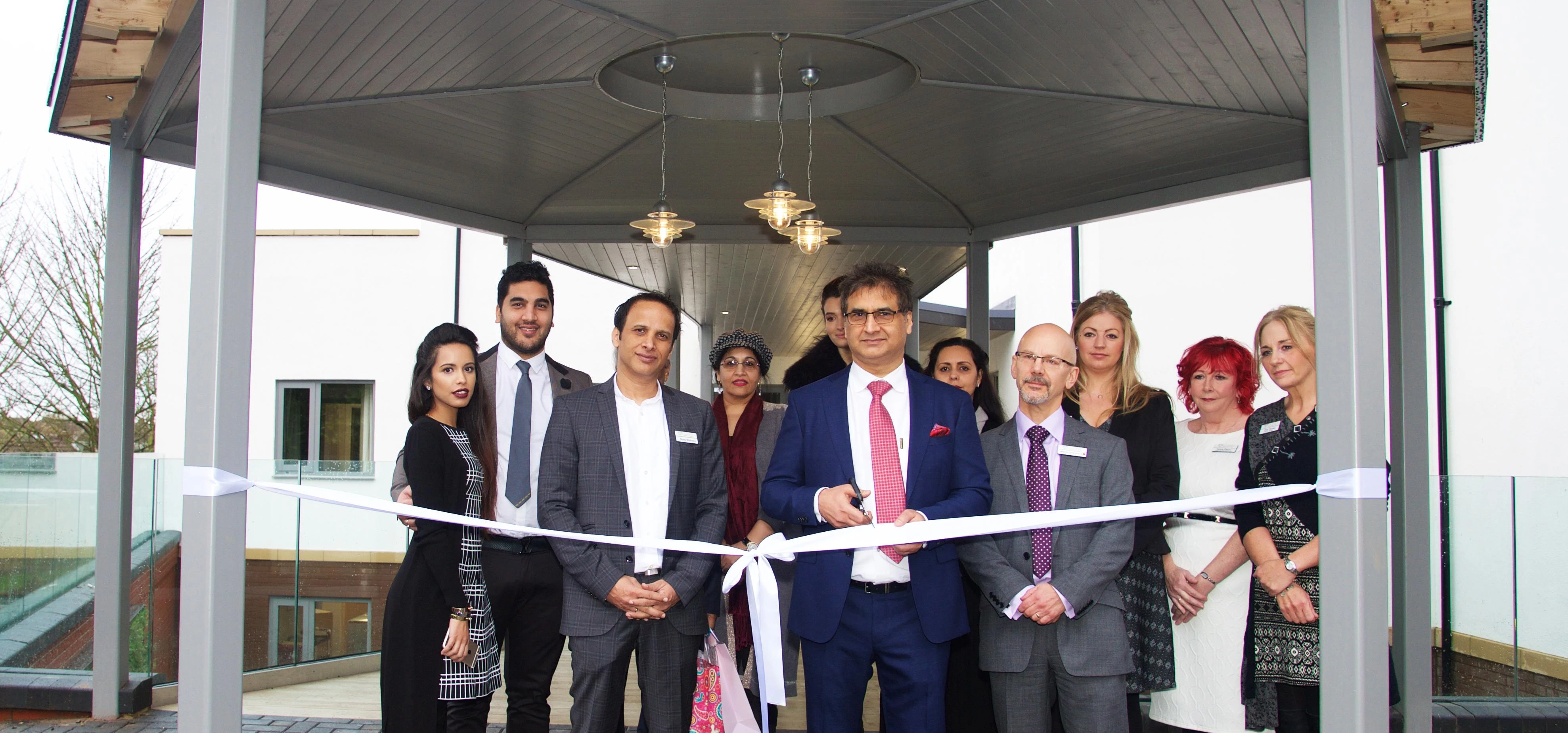Meenu Malhotra cuts the ribbon to declare Melton House officially open
