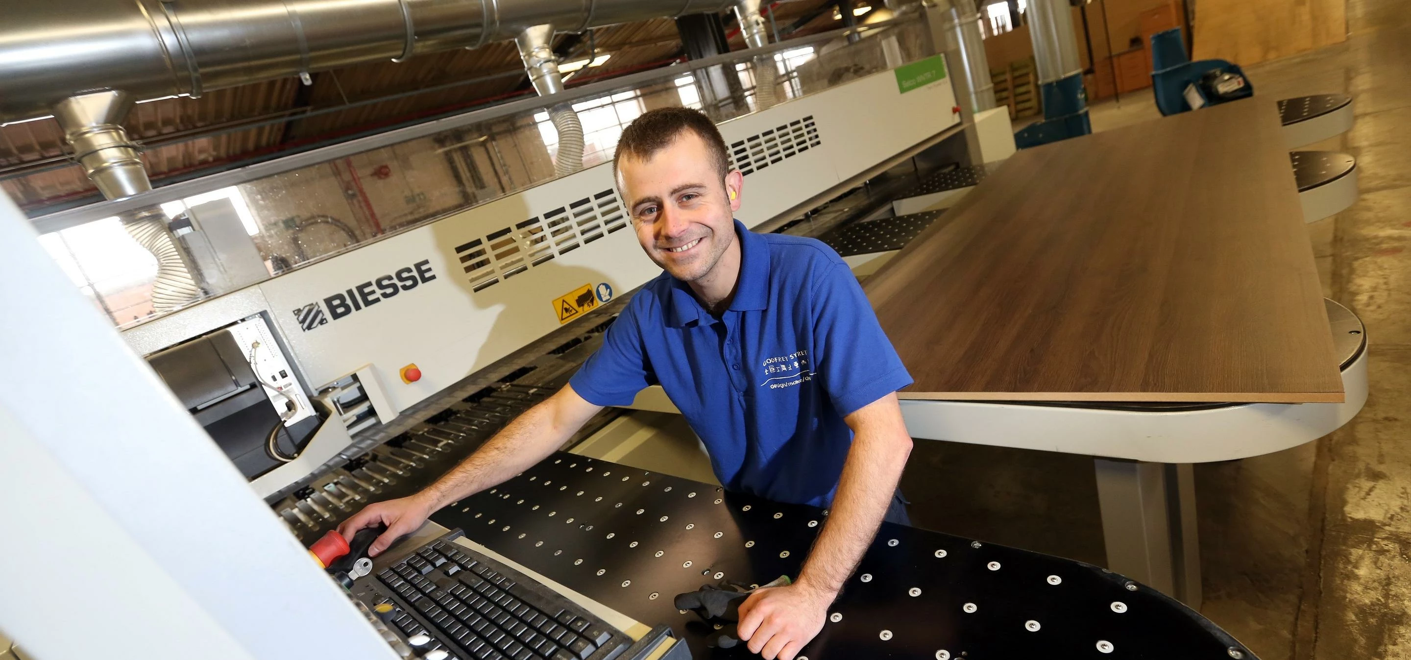 Peter Guarnaccio of Godfrey Syrett operating the new saw at their Durham manufacturing site.