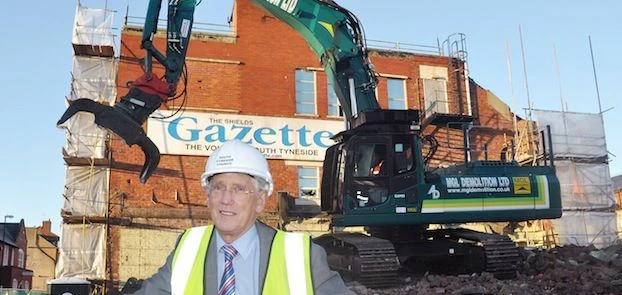 Cllr John Anglin at the demolition site