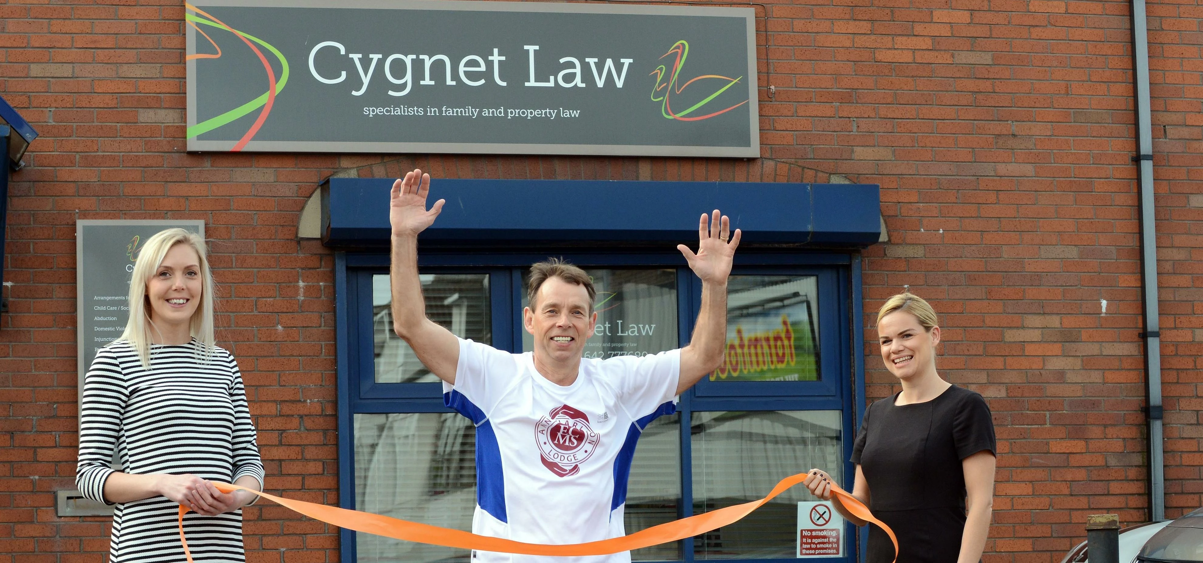 Marathon runner Charlie Bell with Cygnet Law staff Charlotte Brown and Sarah Hancocks