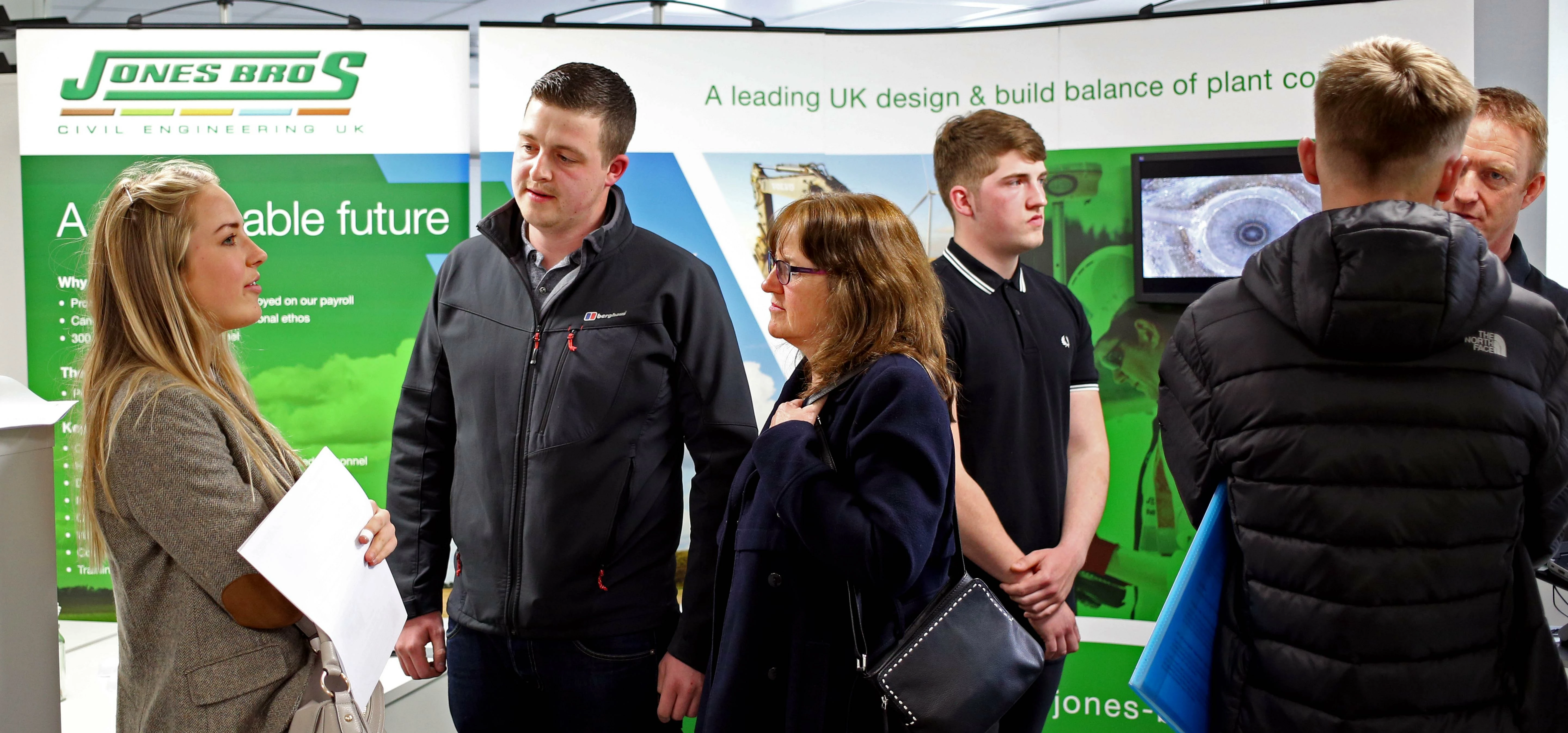 Elliot Bidmead Jones Bros Ruthin chats with mother and daughter Helen and Lowri Swygart from Llandeg