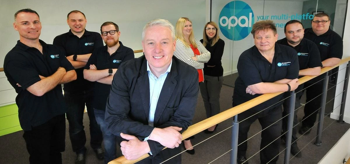 Andrew Metcalfe (front, centre), managing director of Opal, with his team of staff