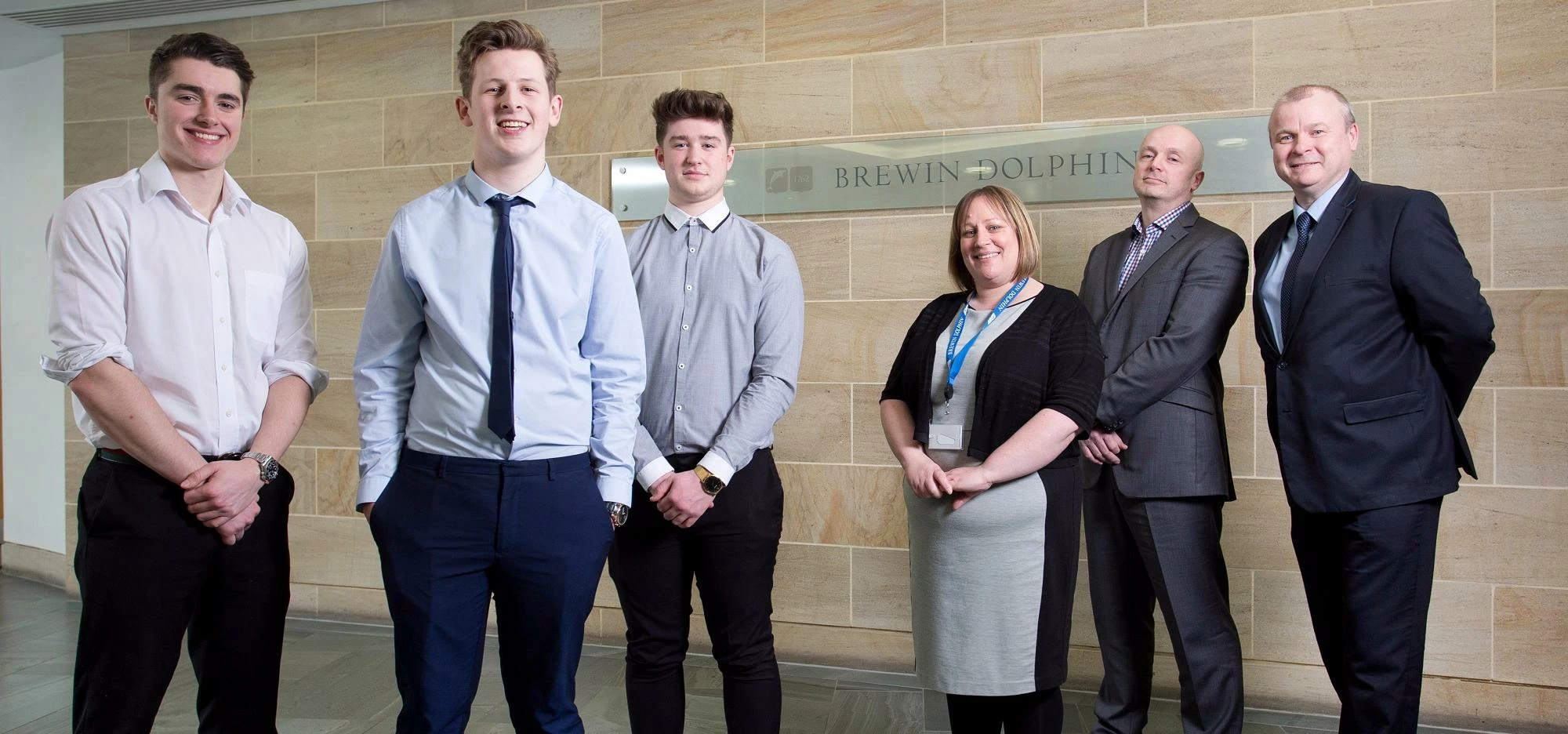 Left to right: apprentices Jerome Hardy, James Capstick, and Matthew Tulip; Claire Martin and John O