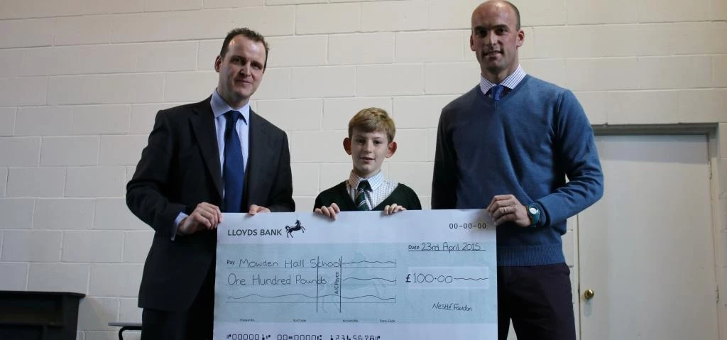 Max Eve receiving the cheque