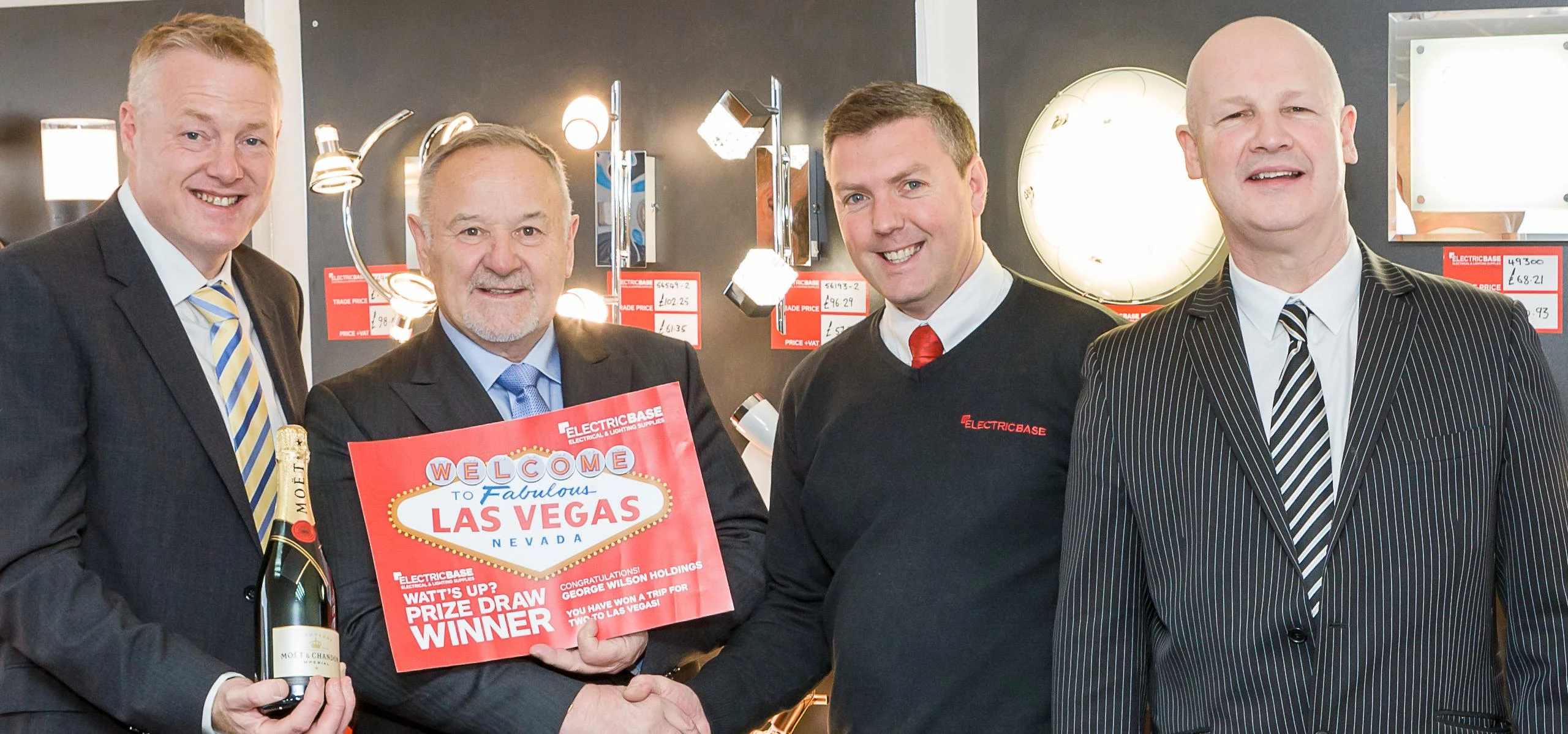 George Wilson (second left) receiving his prize from the Electricbase team