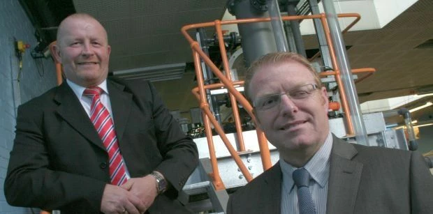 Les Peacock, left, and Dean Fox, right, on the steps of the Three Phase Separator at TTE