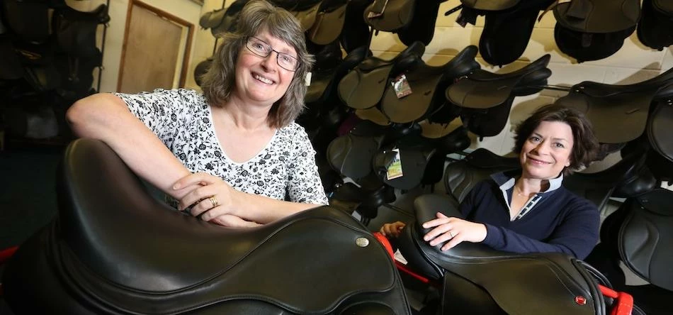 Sue Kirk (left) of UK Steel Enterprise with Lizzy Bunting of Priory Saddlery in the new workshop at