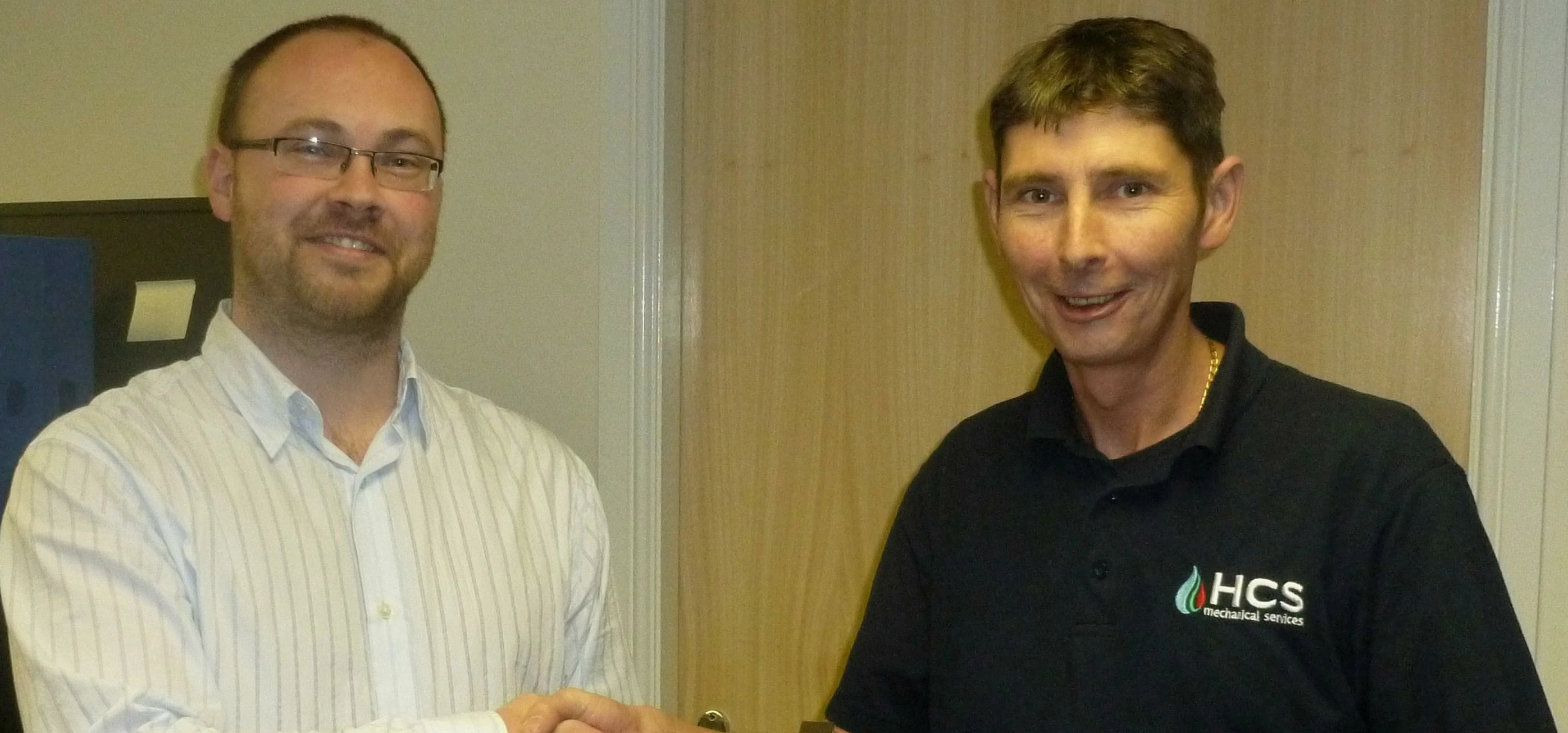 Time to celebrate;  L to R: Operations Director, Barry Taylor and Senior technician, Richard Tatters
